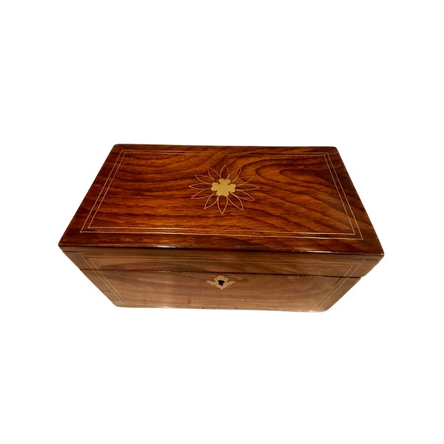 A beautifully crafted 19th‑century Anglo Indian tea caddy made from rich rosewood and decorated with brass inlay. The lid...
