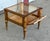 This giltwood vitrine table is glazed on the top and all four sides, and the front panel drops down on hinges so you can...