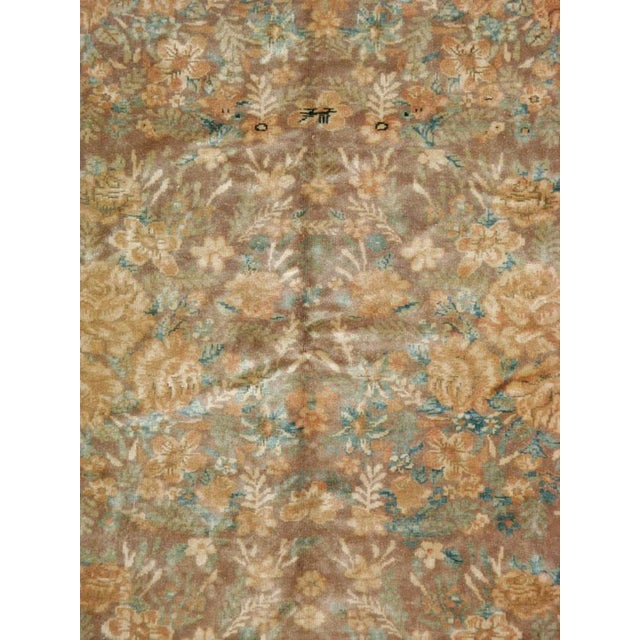 A vintage Caucasian Karabagh carpet from the second quarter of the 20th century with an elegant horror vacui floral...