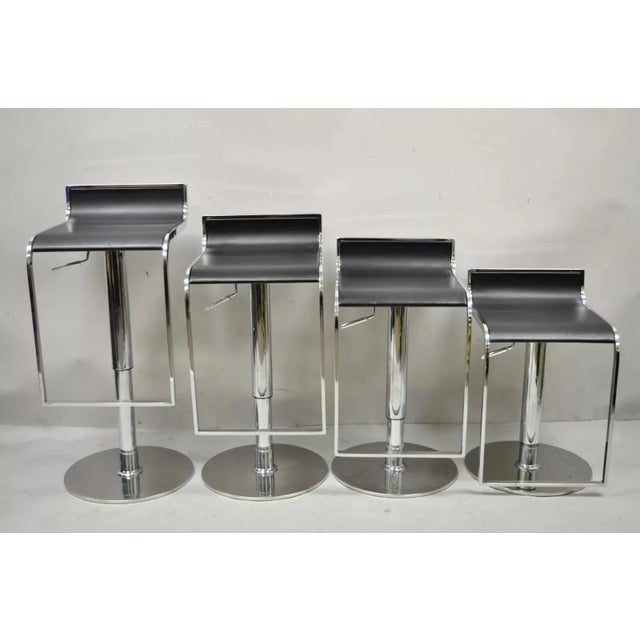 Contemporary Modern Chrome and Steel Black Leather Adjustable Swivel Bar Stools - Set of 4. Listing includes (4) bar...
