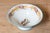 This 19th-century French porcelain piece is a finely crafted example of the decorative artistry of the time, likely...