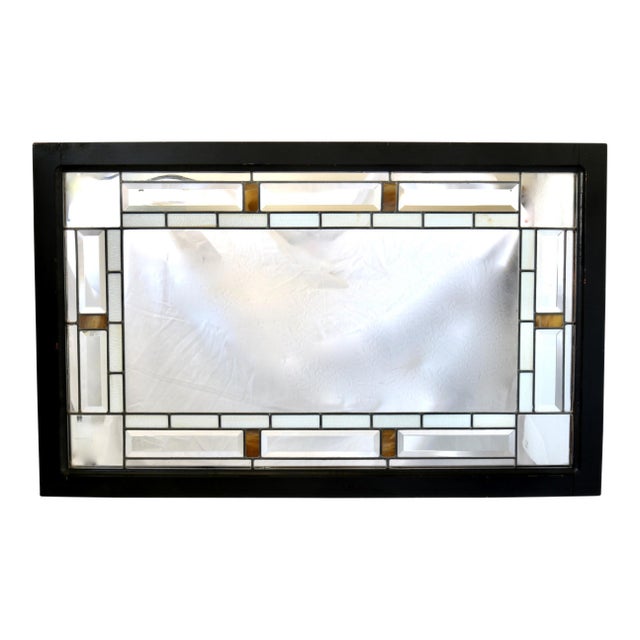 A striking blend of craftsmanship and design, this 1970s mirror features a rich wood frame encasing a stunning interior of...