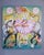 Side Show features a whimsical scene with a central figure dressed in a vibrant ballet costume, surrounded by playful...