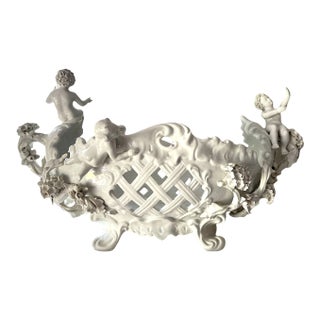 1950s Large Meissen-Style White Porcelain Reticulated Oval Footed Bowl Jardiniere Centerpiece With Four Cherubs For Sale