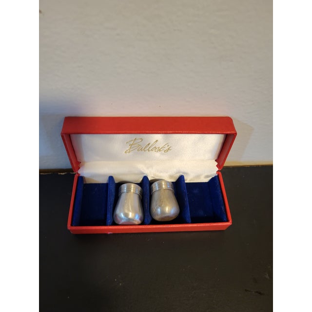 Two individual stainless steel salt & pepper shakers in their original box. Bullacks manufactured in Sheffield, England...