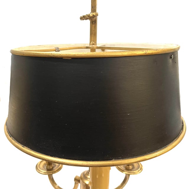 Charming 3-arm vintage brass "Bouillotte lamp. Takes standard candelabra bulb sockets. Adjustable black tole shade with...