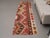 Vintage Hand-Knotted runner rug is a semi-antique vintage area rug. The '70s Eastern region of Anatolia's unique rug is...