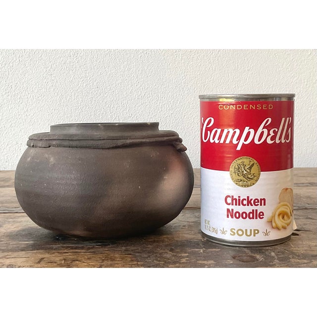 This vintage studio art pottery vessel by Kaplan is a masterclass in organic abstraction and subtle Brutalist design....