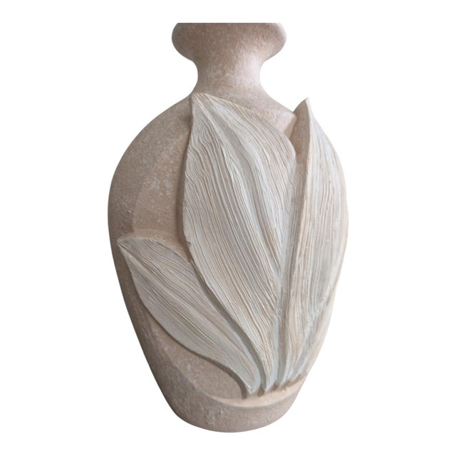 A striking vintage table lamp by Sunset, featuring a sculptural banana-leaf design in raised relief. The layered leaves...