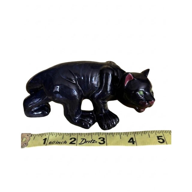 Exuding mid-century drama and sleek, atomic-era sophistication, this vintage ceramic prowling black panther is a...