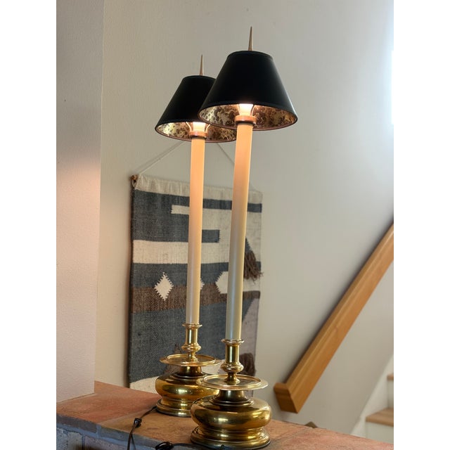 Stunning pair of classic tall Chapman lamps with bulbous cast brass bases with tall central columns with original black...