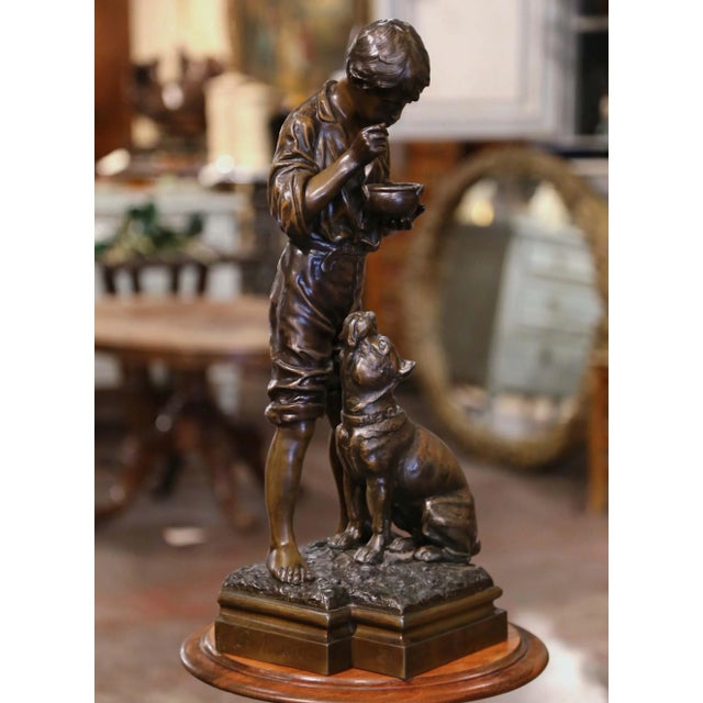 Capture a charming moment of everyday life with this antique Belgian sculpture by Victor Rousseau. Crafted circa 1932, the...