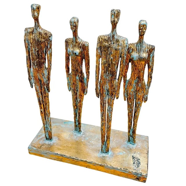 Slender, modern and with an utilitarian aesthetic, this brutalist style metal sculpture features two standing couples, two...