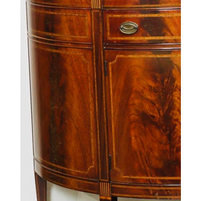 You could spend the evening staring into the fireplace… or simply stare at this cabinet. Frankly, the flame mahogany may...