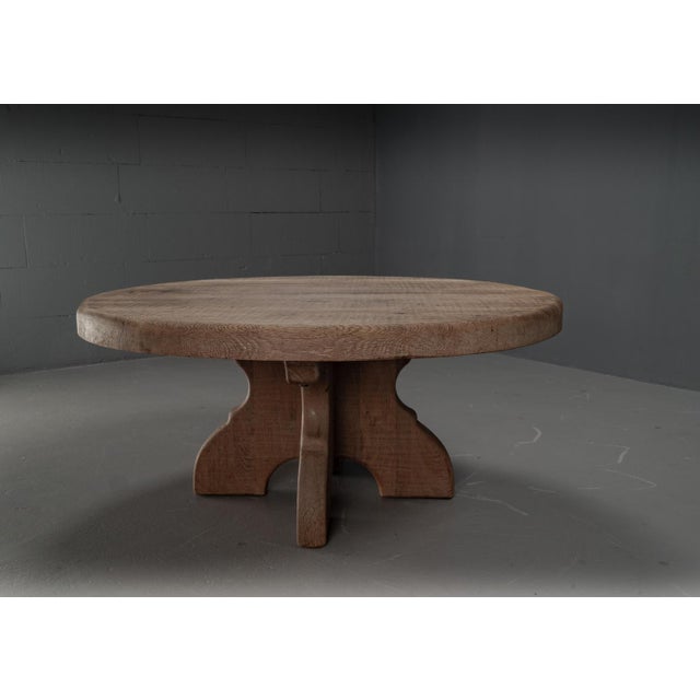 Large and heavy rustic rural round coffee table on a four-legged oak base. The thick, rounded oak top offers enough space...
