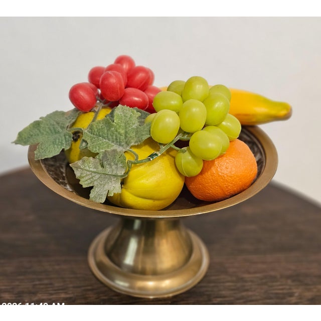 This vintage 1960s Korean brass compote serving bowl features intricate banding with relief carved cranes, showcasing...