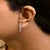 Discover elegance redefined with these exquisite .925 sterling silver dangle earrings, beautifully plated in rhodium for a...