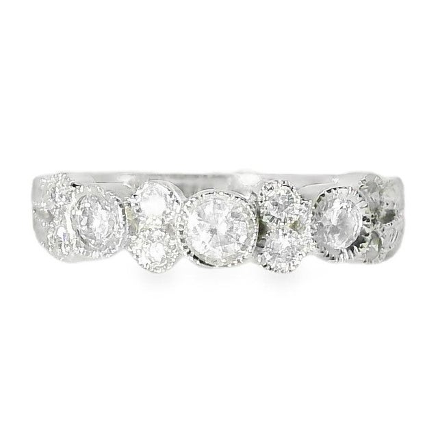 Material: 14K White Gold Stones: 11 Brilliant Round Diamonds - 0.4 carats total Band Width: 3/16 inch Ring Size: 7 Weight:...