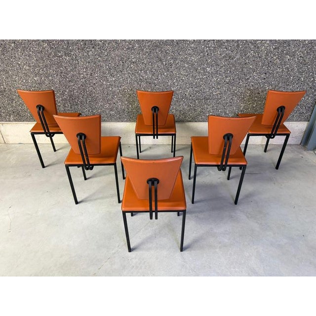 Elegant brown leather and metal dining chairs. Beautiful black metal frames. 1980s - Belgium Dimensions: Height: 86cm...