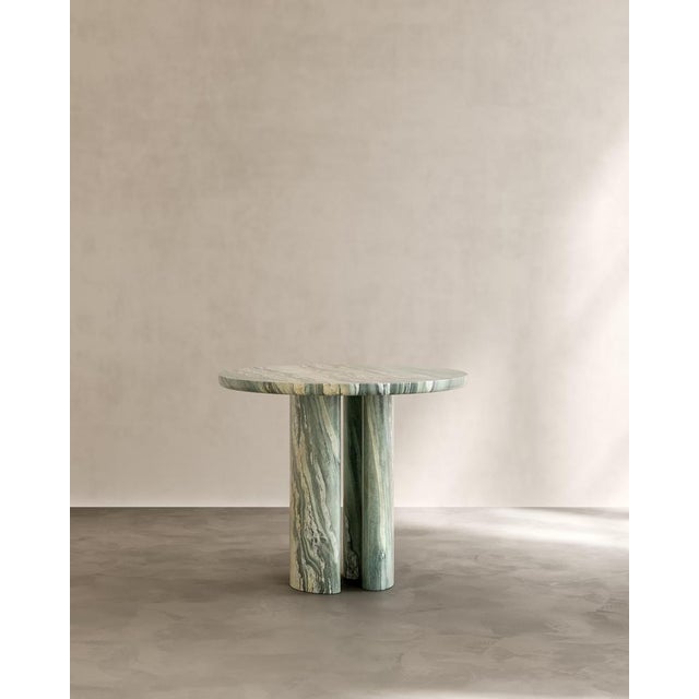 Roman dining table i in cippolino marble by paloma editions dimensions: d 90 x w 90 x h 75 cm. Materials: marble. The...