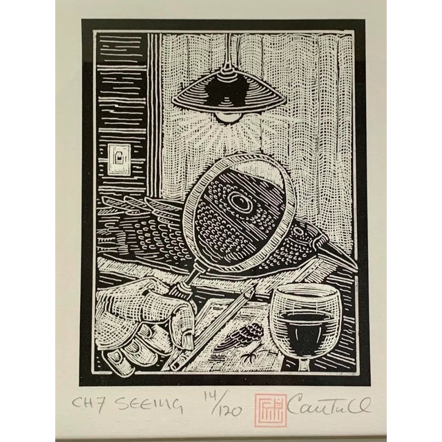 Stunning framed, signed and numbered woodblock print of a bird being examined under a magnifying glass titled “Seeing”....