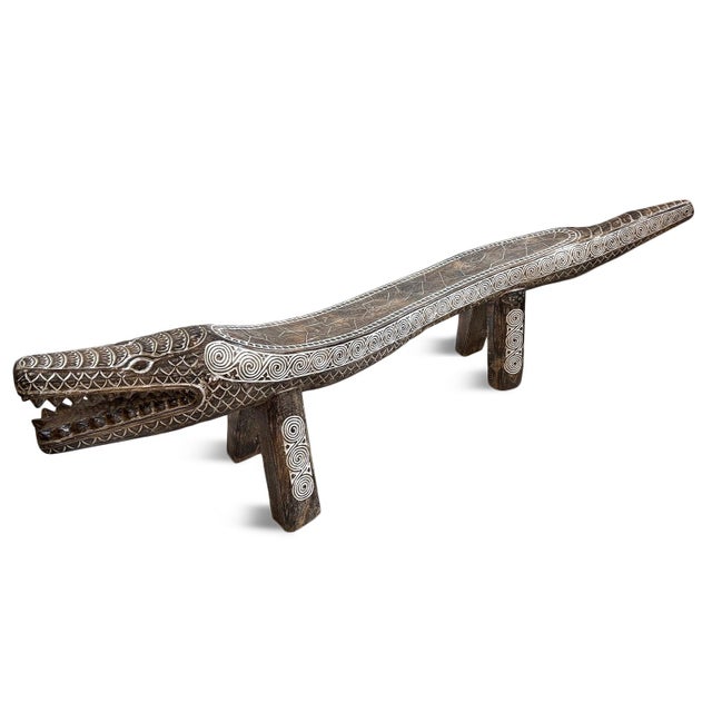Impressive large-scale hand-carved crocodile bench from Indonesia, sculpted from a single solid log and richly detailed...