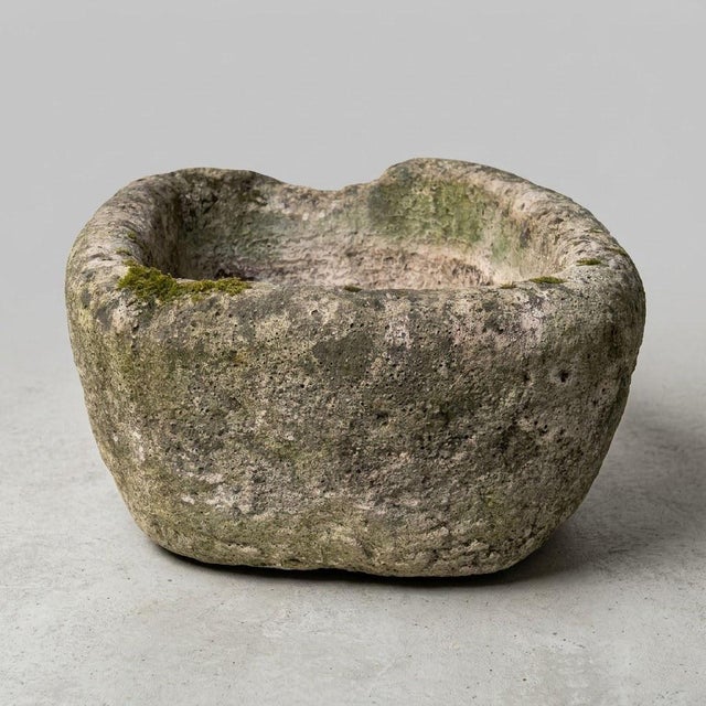 A superb utilitarian vessel carved from a single block of natural stone, this 19th-century trough-crucible embodies the...