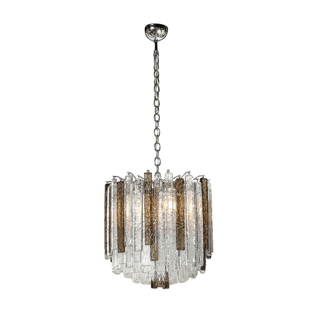 This elegant pair of Mid-Century Modernist pendant chandeliers, designed and crafted by the esteemed Italian glassmaking...