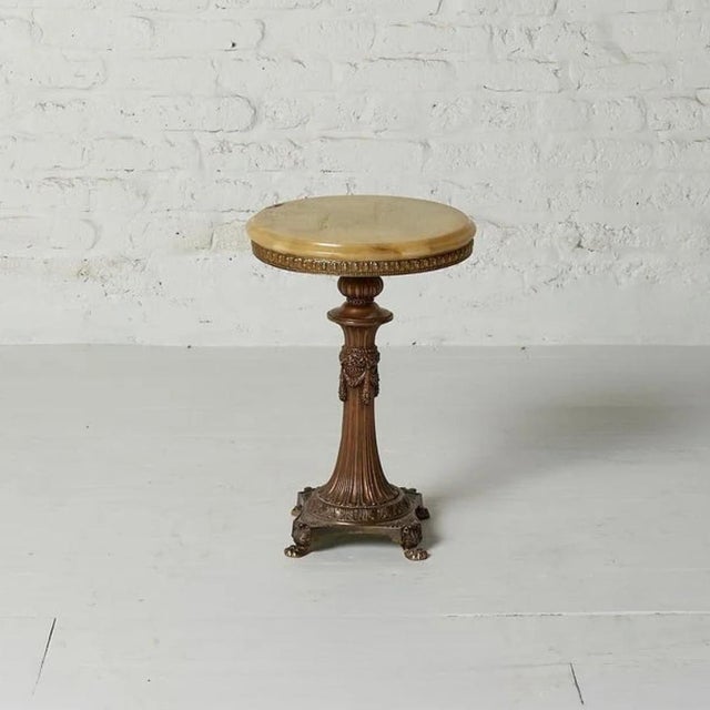 This 1920s Belgian marble and brass side table blends refined materials with timeless European elegance. Featuring a...