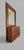 A rare wall mirror crafted from precious wood, adorned with linear and architectural marquetry, characteristic of late...