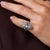 This elegant Art Deco diamond and sapphire ring is a beautifully detailed jewel from the 1930’s, featuring 19 old mine and...