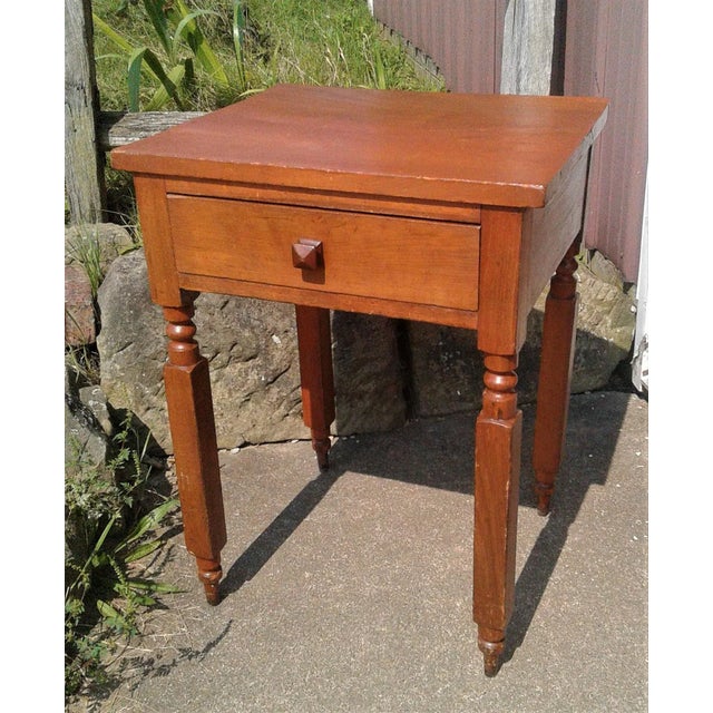 Antique Cherry One Drawer Stand 1860s Era An antique solid cherry one drawer stand that dates back to the 1860s era....