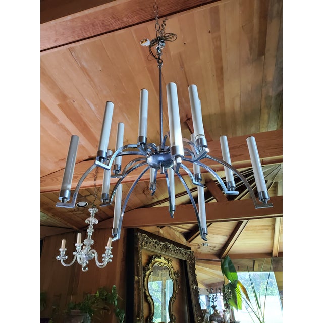 A rare vintage original ( 1960's high end designer) spider form fifteen lights chrome chandelier. Superbly constructed...