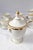 with hand-painted fine gold details and impeccable porcelain, the sugar bowl handles and the teapot and coffee pot spouts,...