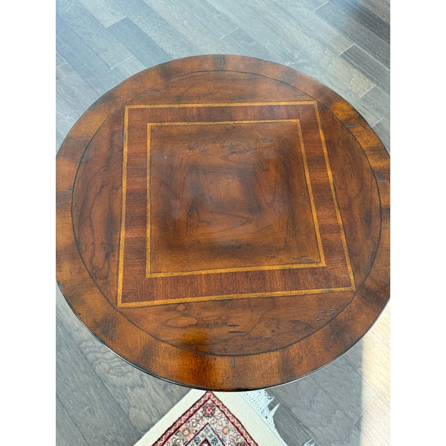 Pair of Hooker furniture round, pedestal accent tables. Cherry and walnut Heavy tables in excellent condition. Moving.must...