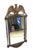 A vintage, mirror by Burwood Products with colonial details and large bald eagle with branches and arrows in the talons....
