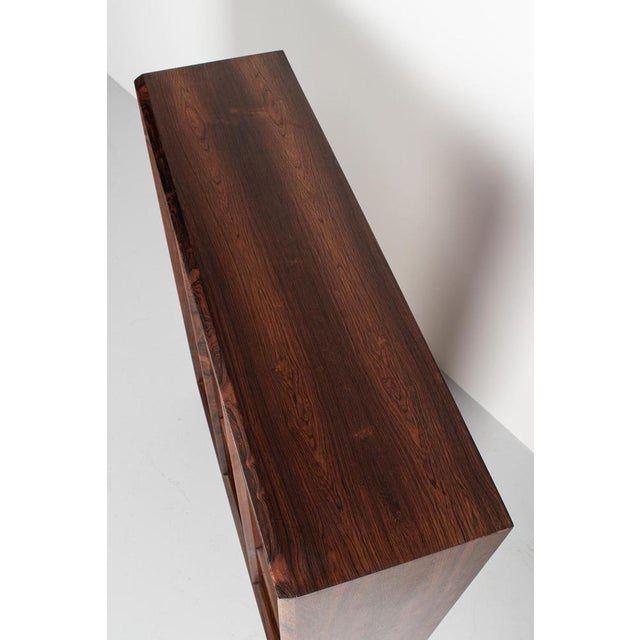 Stunning rosewood cabinet with shelves to store books or display your collection. Blind shelves with no visible shelf...