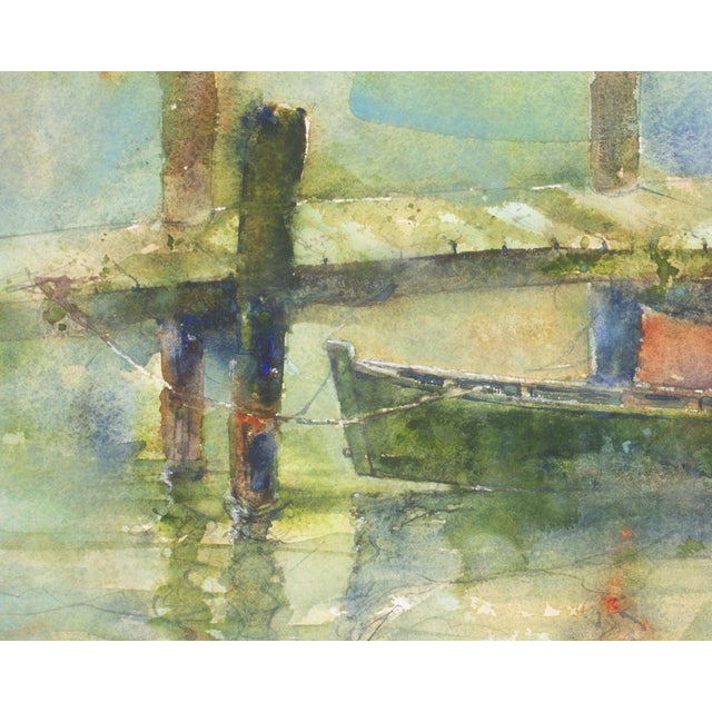 A watercolor painting of a boat by the American artist Bill Abell (1935-2026). This painting features a wooden boat tied...