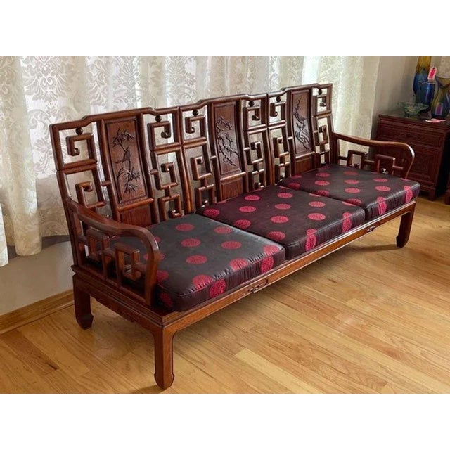Asian Rosewood Sofa With Crane And Cherry Blossom Motif. Includes Two Sets Of Seat Cushions. Good condition. Solid...