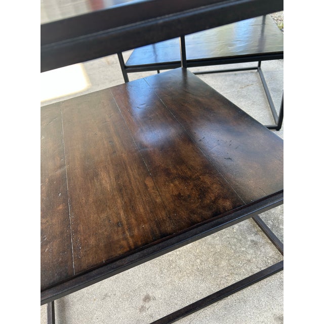 Softly minimal, these two side tables have light scale, minimalist hand constructed steel frame in a classic Dark Bronze...