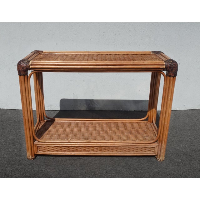 Gorgeous Table in Good Vintage Condition. It is solid and Firm. There is some missing Leather twine. Otherwise, Wear is...