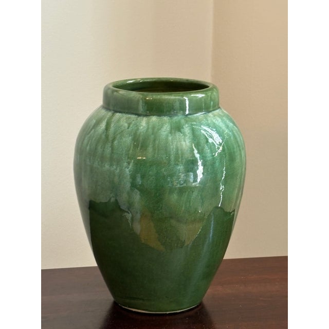 Offering a gorgeous handcrafted artisanal pottery tall vase in a sumptuous green glaze. A real beauty!