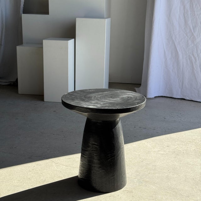 Side table made of natural solid black wood. Crafted from a single piece of wood (monoxyl). Ideal as a side table or...