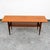 Solid teak danish modern surfboard coffee table. The solid teak and teak veneer top surface sits upon 4 solid teak tapered...