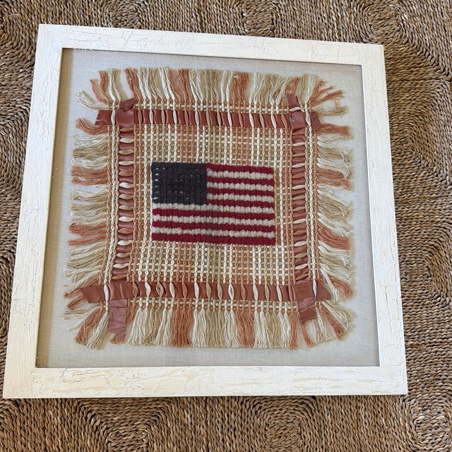 Charming vintage American folk art textile featuring a hand-worked American flag surrounded by an elaborate woven and...