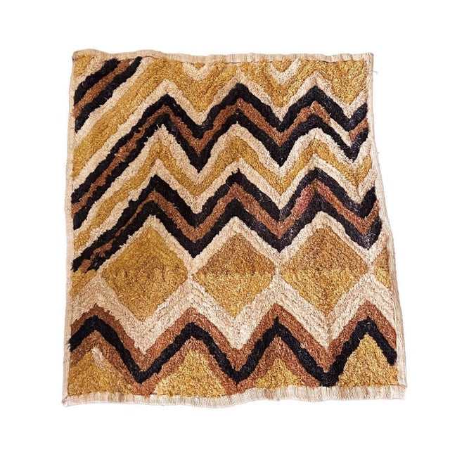 This exquisite Kuba Kasai Velvet Boutallah Raffia Textile from Zaire in Africa features geometric designs made of natural...