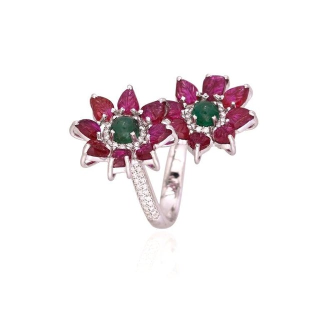 A very gorgeous and beautiful, Emerald & Ruby Cocktail Toi et Moi Ring set in 18K White Gold & natural Diamonds. The...