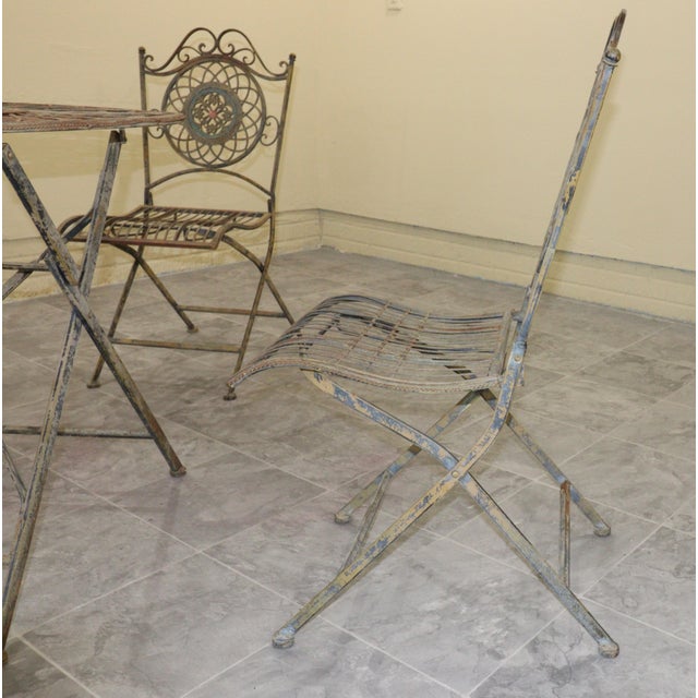 Bring the romance of an Italian garden terrace to a courtyard, veranda, or breakfast nook. This five-piece wrought iron...