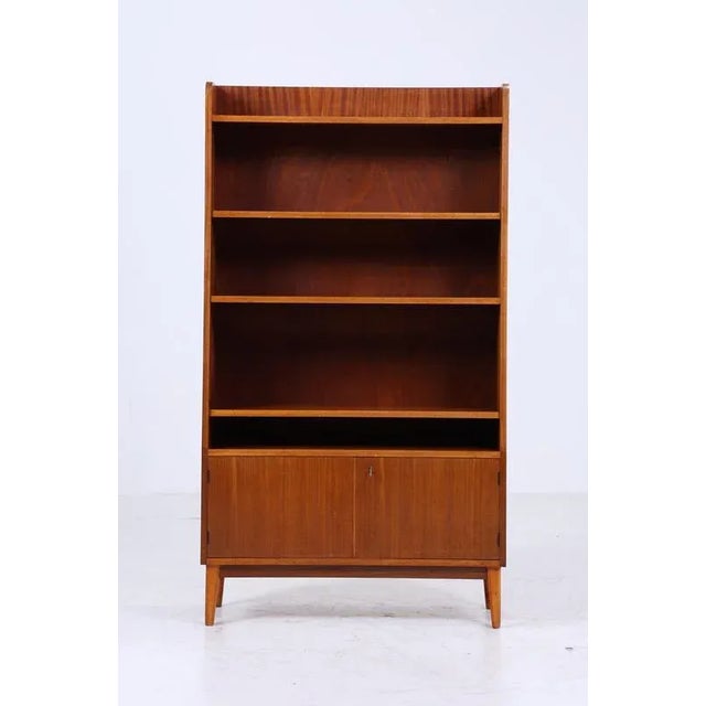 Beautiful vintage shelf from the 60s FEATURES * High-quality workmanship * 3 shelves * Material: wood * 2 doors with a key...