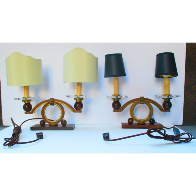 A fine pair of French Art deco Shelf or table lamps. Mounted on Macassar wood with brass and copper bronze arcs over a...